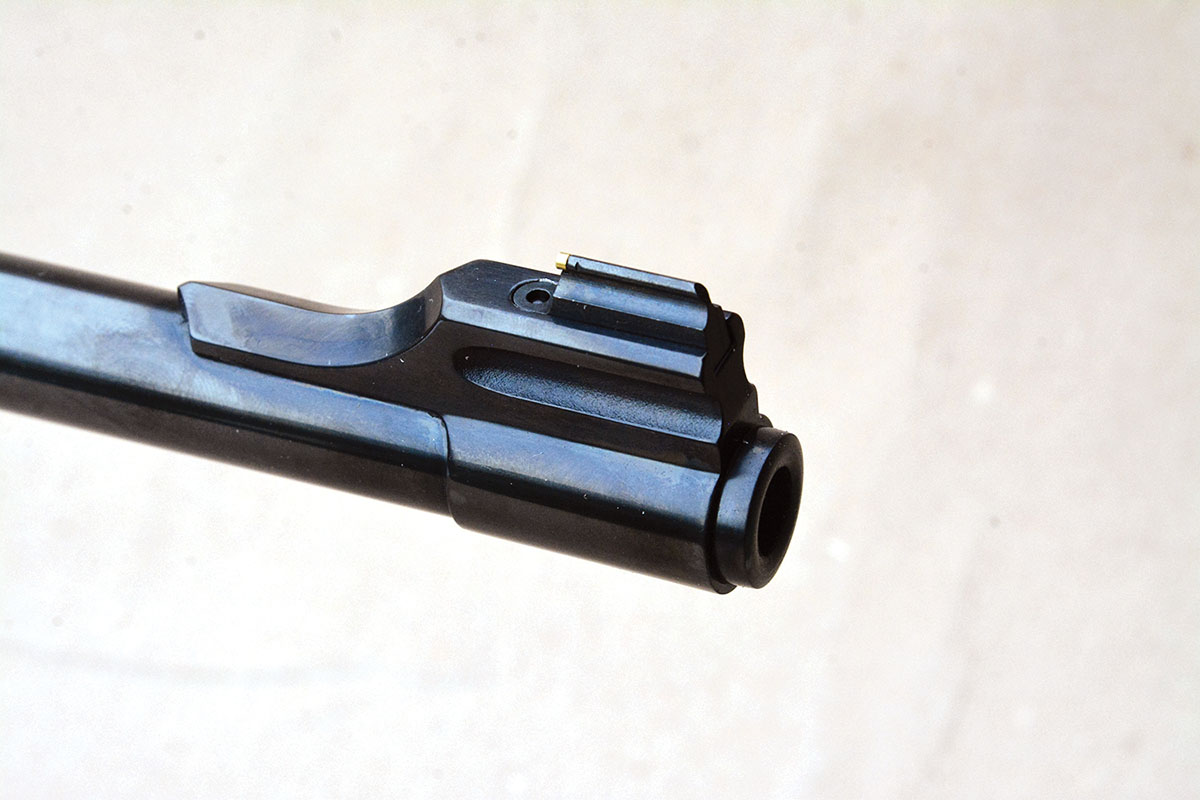 A banded front sight with interchangeable sight options is featured.